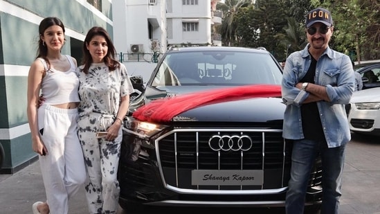 Shanaya Kapoor, her parents Maheep Kapoor and Sanjay Kapoor pose with their new car.