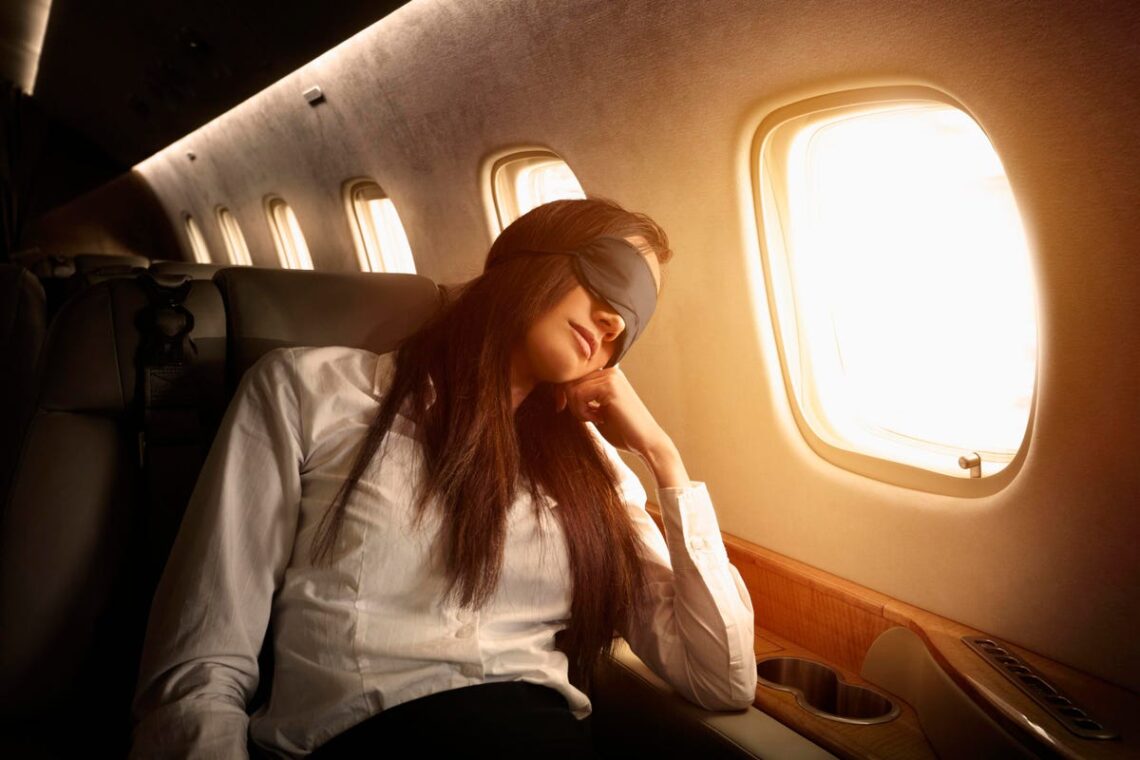 4 Ways To Sleep Better When You Travel, According To Sleep Experts