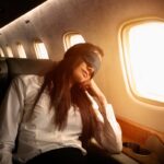 4 Ways To Sleep Better When You Travel, According To Sleep Experts