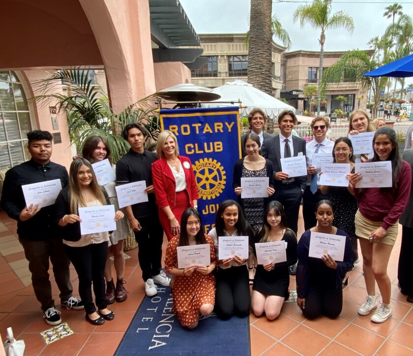 Eileen O'Neill Jolly presents students with scholarships from the Rotary Club of La Jolla. 