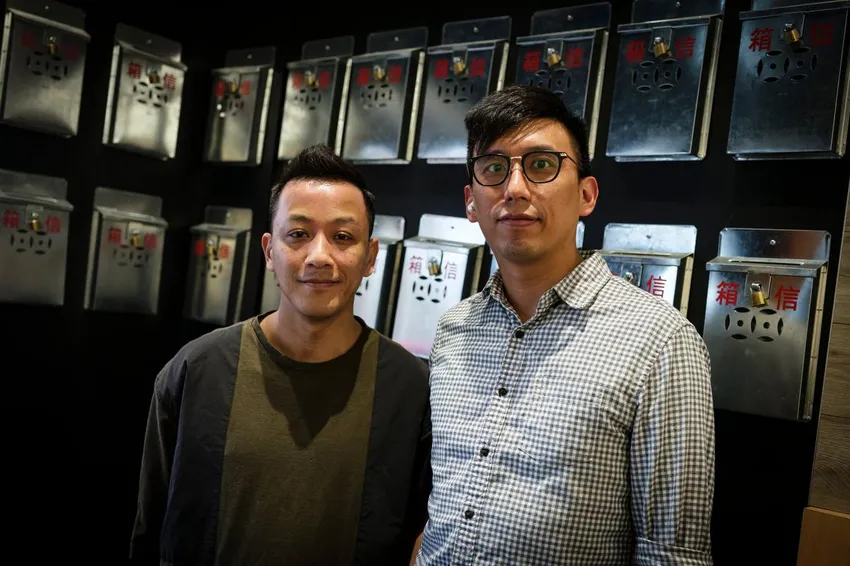 Cha Kee restaurant owner Jacky Lam, left, and Isaac Yeung, manager of Cha Kee's Richmond Hill location, show off the rows of vintage letterboxes synonymous with Hong Kong.
