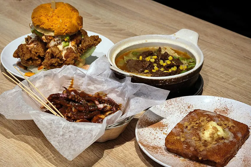 Among the specialties at Cafe De Hong Kong are the pineapple bun chicken sandwich, satay beef with instant noodles, street-style squid tentacles and French toast with a salted egg yolk centre.