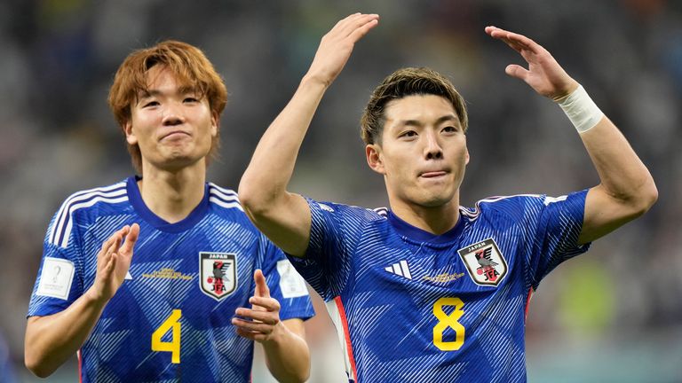 Japan's Ritsu Doan (right) celebrates after scoring his side's opening goal against Germany